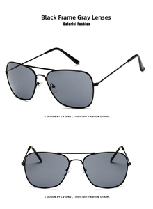Detail view of double-bridge aviator sunglasses with black metal frames and grey lenses