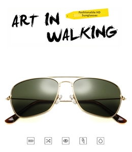 Detail of vintage gold metal aviator sunglasses with HD lenses and double bridge design