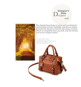 Detailed view of the brown crocodile pattern Boston bag with detachable long shoulder strap
