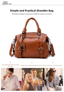 Detail of tan crocodile pattern PU leather Boston bag with detachable strap and metal accents