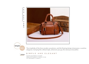 Detail of vintage caramel brown leather bag showing metallic buckles and textured finish