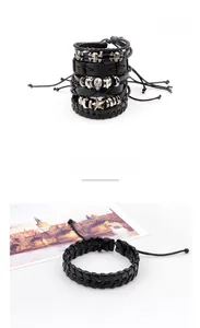 Detail view of 4-piece punk leather bracelet set with metal skull and star charms