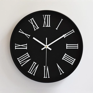 Modern 12 inch wall clock with matte black dial and white 3D Roman numerals