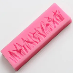 Pink rectangular silicone mold with intricate leaf and grass patterns for fondant cake decor