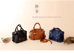 Three crocodile pattern Boston bags in black, tan, and navy with detachable straps