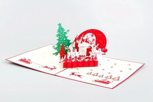 Detail of 3D pop-up Christmas card featuring Santa's sleigh, reindeer, and pine trees