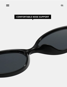 Detail of comfortable integrated nose support on black glossy oval sunglasses