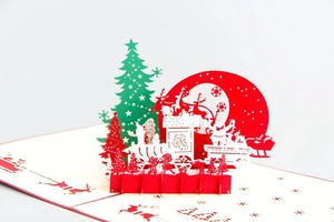 Detailed 3D Christmas card featuring laser-cut reindeer and Santa Claus on a sleigh