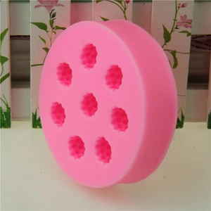 Pink silicone mold for raspberry candies with eight bear-shaped cavities for baking