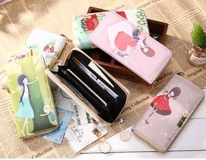 Flat lay of long vintage PU leather wallets with cartoon illustrations and internal slots