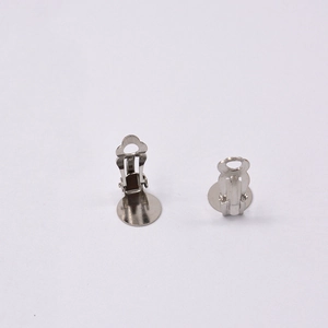 Detailed view of silver metal clip-on earring converters for non-pierced jewelry making