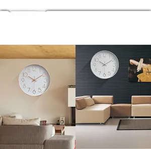 Detail of modern 12-inch round wall clocks in rose gold and silver minimalist metal frames