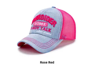 Detail of blue denim trucker hat with rose red mesh and candy talk embroidery