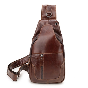 Macro shot of brown leather texture and zipper detail on retro men chest bag
