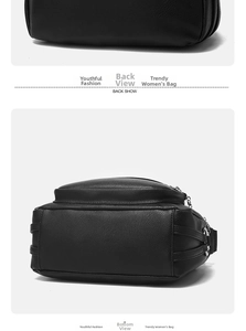 Detail view showing black litchi pattern leather texture and back pocket of the shoulder bag