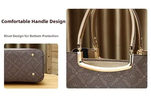 Detalle de asa metálica cómoda y remaches protectores en la base del bolso con estampado