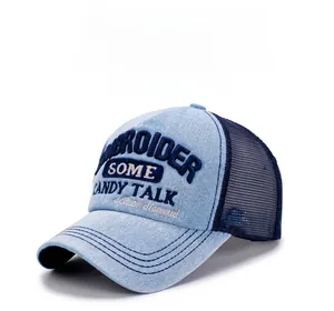 Detail of blue denim baseball cap with breathable mesh and SOME CANDY TALK embroidery