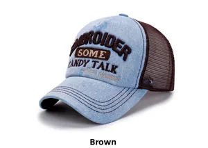 Detail of light blue denim trucker hat featuring brown mesh and 3D candy talk embroidery