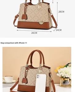 Size comparison of beige monogram tote bag with iPhone 11 and dimensions 26x20x14cm