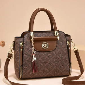 Brown monogram handbag with golden hardware and a cute cat tassel charm for women