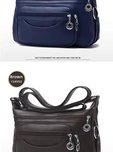 Detail of soft leather crossbody bag with multiple zippers and star metal pulls