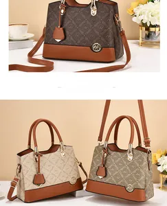 Detailed view of three vintage-style crossbody bags with monogram and long straps