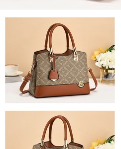 Close-up of brown leather stitching and golden logo on the luxury monogram handbag