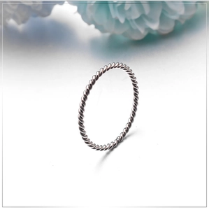 Elegant minimalist twisted rope ring in polished stainless steel for women