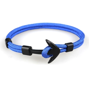 Macro detail of blue paracord braided rope with black matte anchor shackle closure