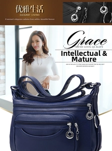 Detail of blue leather shoulder bag with multi-layer zippers and star metal pulls