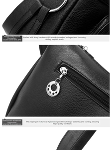 Detail of black pebbled leather texture with silver star-pendant zipper and metal rings