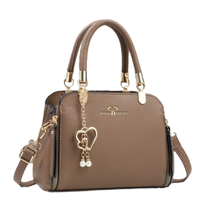 Dark brown lychee leather handbag with golden heart pearl charm and shoulder strap