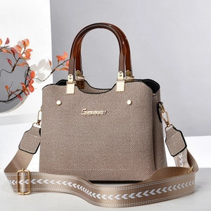 Brown woven texture tote bag with acrylic handles and stylish geometric pattern strap