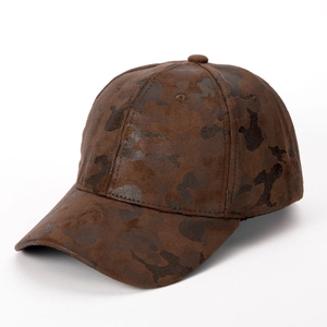 Close-up of brown camouflage baseball cap featuring a premium brushed faux leather texture