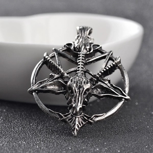 Detailed view of gothic goat head pendant in antique silver finish with textured surface