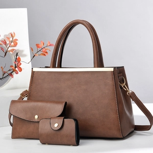 Three-piece brown leather handbag set including tote bag, envelope clutch and small wallet