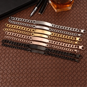 Flat lay of Cuban link ID bracelets in silver, gold, rose gold, and black steel