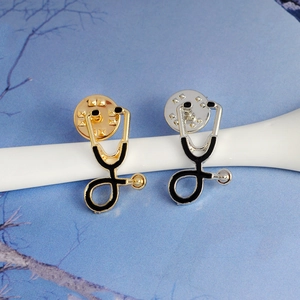 Creative doctor stethoscope brooch in gold and silver finish with alloy enamel detail
