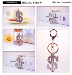 Detail view of sparkling silver dollar sign keychain with crystal rhinestones