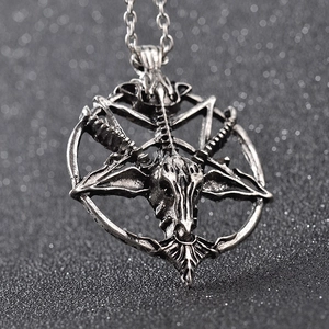 Macro shot of silver Baphomet pentagram pendant with vintage oxidized finish details