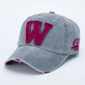 Detail of army green washed baseball cap with burgundy W patch and distressed brim effect