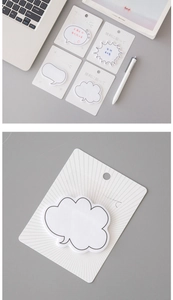 Detailed view of white speech bubble sticky notes with minimalist black borders and paper texture