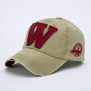 Detail of vintage washed khaki baseball cap with red letter W patch and side embroidery