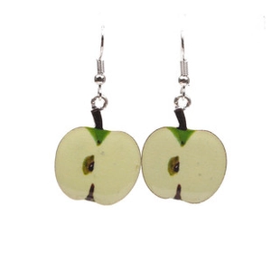 Detail shot of novelty green apple slice earrings with realistic seed and pulp textures