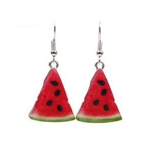 Detail view of creative watermelon slice earrings with vibrant red and green resin texture