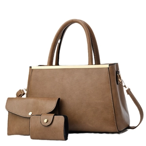 Vintage brown three-piece women's handbag set including tote, envelope clutch and purse