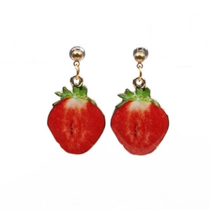 Detailed view of realistic strawberry earrings with vibrant red and green enamel finish