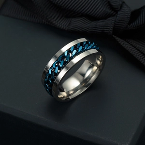 Macro shot of a men's rotatable blue chain inlay ring made of silver titanium steel