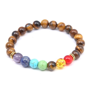 Macro shot of solar system galaxy bracelet with natural stones and golden spacer beads