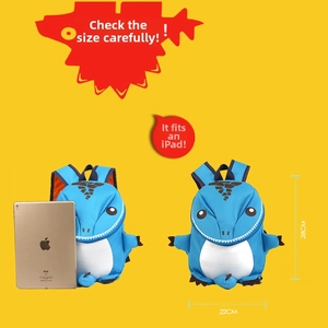 Blue dinosaur kids backpack shown next to an iPad for size comparison 28cm height
